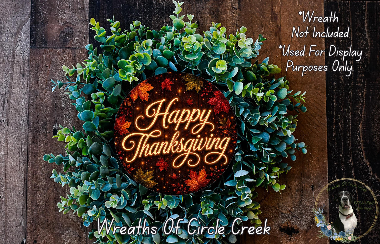 A wreath made of green leaves and a red circular sign with the text "Happy Thanksgiving" displayed on it.