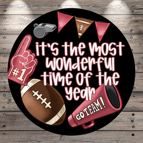 a football-themed design with various football-related items, including a football, a football helmet, a football, and a football-related object. The text on the image reads "It's the most wonderful time of the year" and "GO TEAM!"