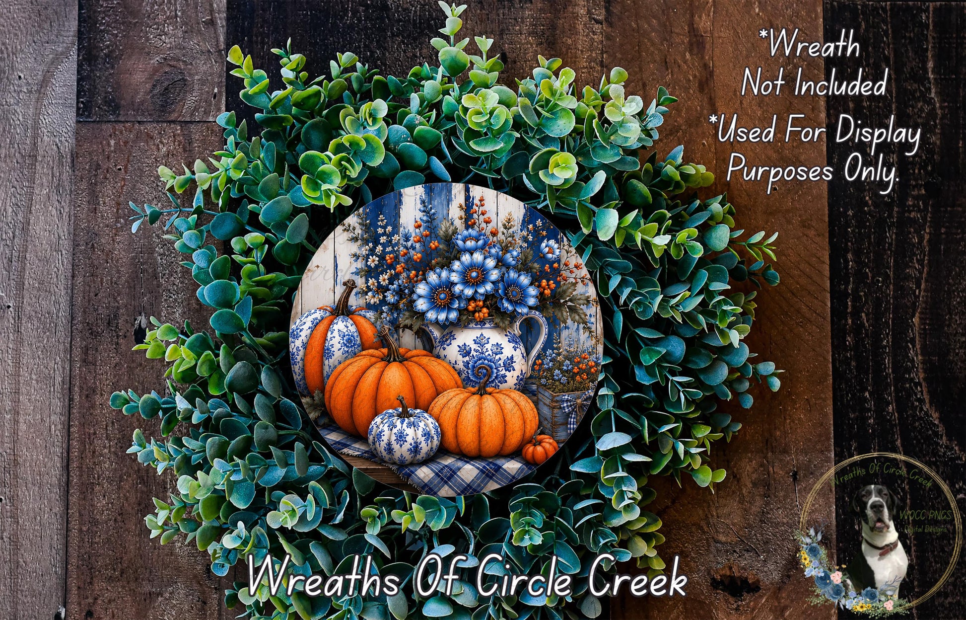 a wreath made of various fall-themed elements, including pumpkins, flowers, and greenery, set against a wooden background.