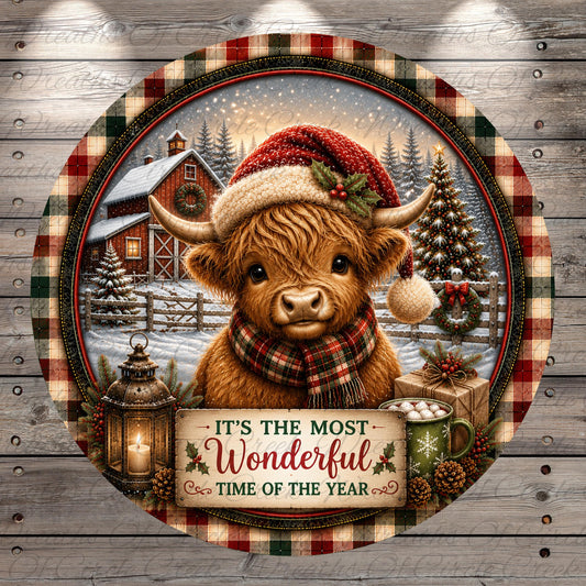 A round, decorative plate featuring a brown cow wearing a Santa hat and scarf, surrounded by holiday decorations such as a lantern, pine cones, and a Christmas tree. The plate has a festive, holiday-themed design with a barn and snow in the background.