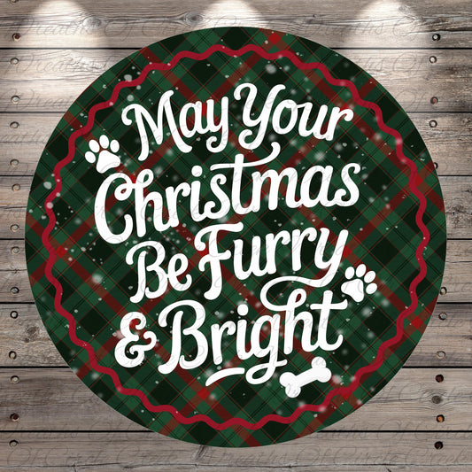 A circular Christmas-themed sign with the text "May Your Christmas Be Furry & Bright" against a plaid background with snowflakes.