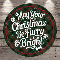 A circular Christmas-themed sign with the text "May Your Christmas Be Furry & Bright" against a plaid background with snowflakes.
