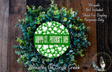A wreath made of green leaves and white clovers, with the text "Happy St. Patrick's Day" displayed on it.