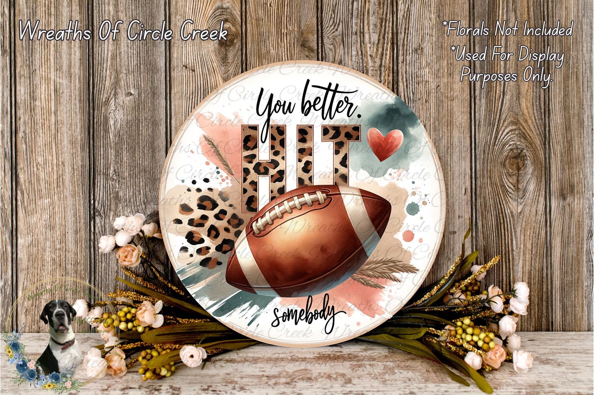 a decorative football-themed wreath with the text "You better. Hit it somewhere." The wreath is surrounded by a floral arrangement and a leopard print design.