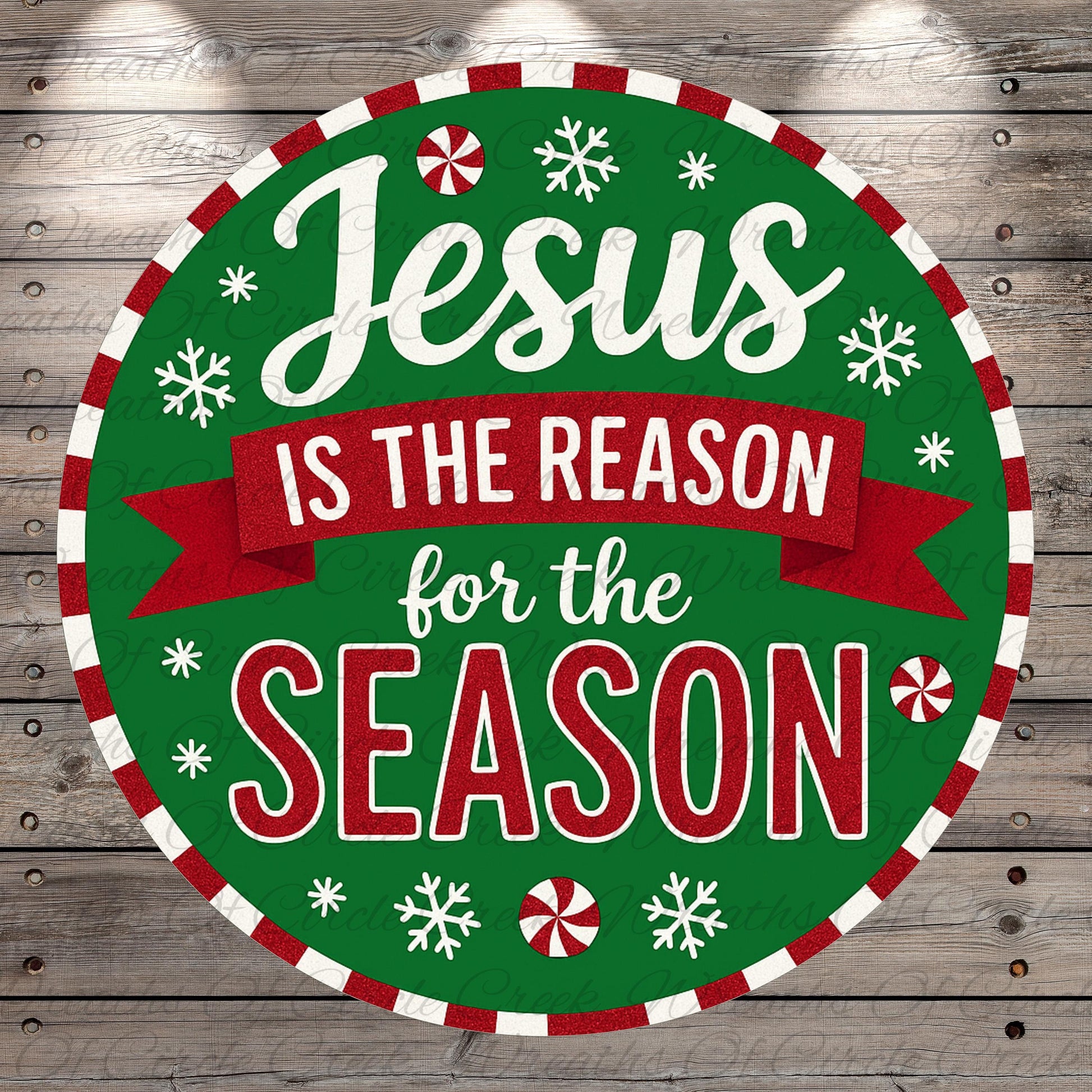 A circular Christmas-themed sign with the text "Jesus is the reason for the season" in a festive style, surrounded by snowflakes and red and white stripes.