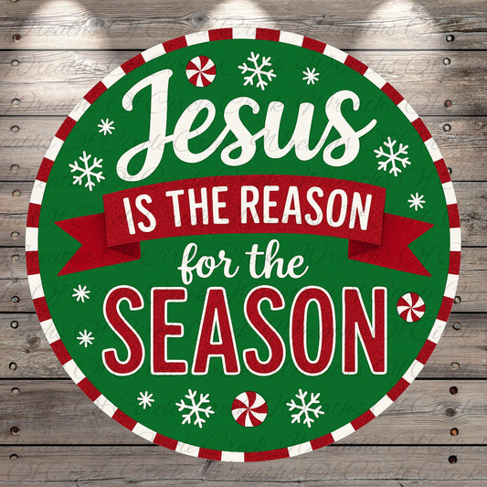 A circular Christmas-themed sign with the text "Jesus is the reason for the season" in a festive style, surrounded by snowflakes and red and white stripes.