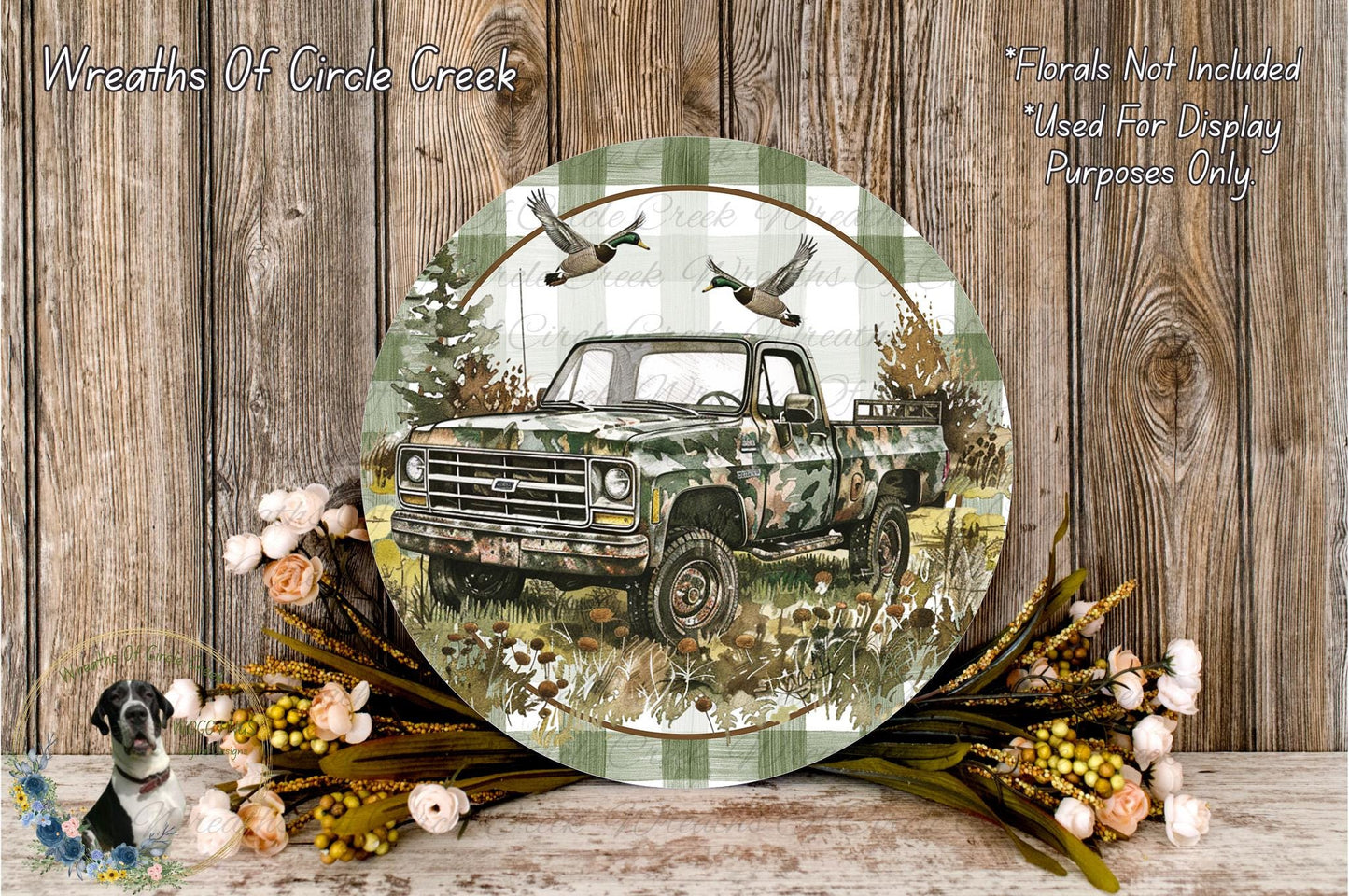 a round, decorative plate with a camouflage truck and a pair of ducks in flight, surrounded by a wreath of flowers and foliage.
