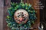 A wreath made of green leaves and flowers, with a raccoon holding a heart-shaped ornament in the center.
