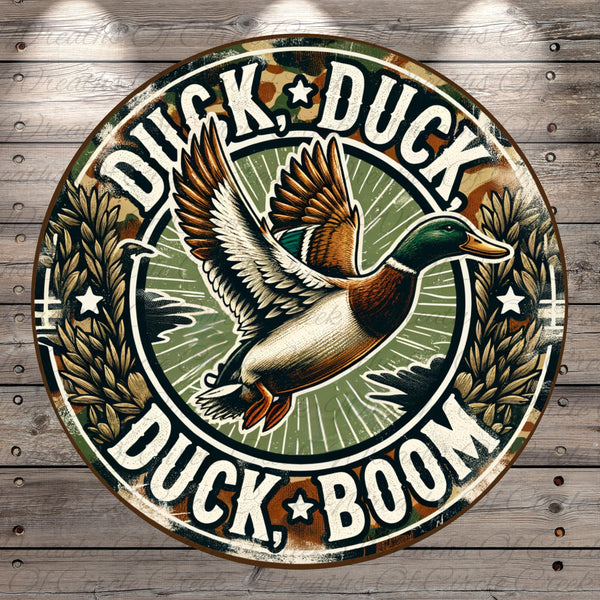A circular sign featuring a cartoon duck in flight with the text "Duck, Duck, Boom" around it.