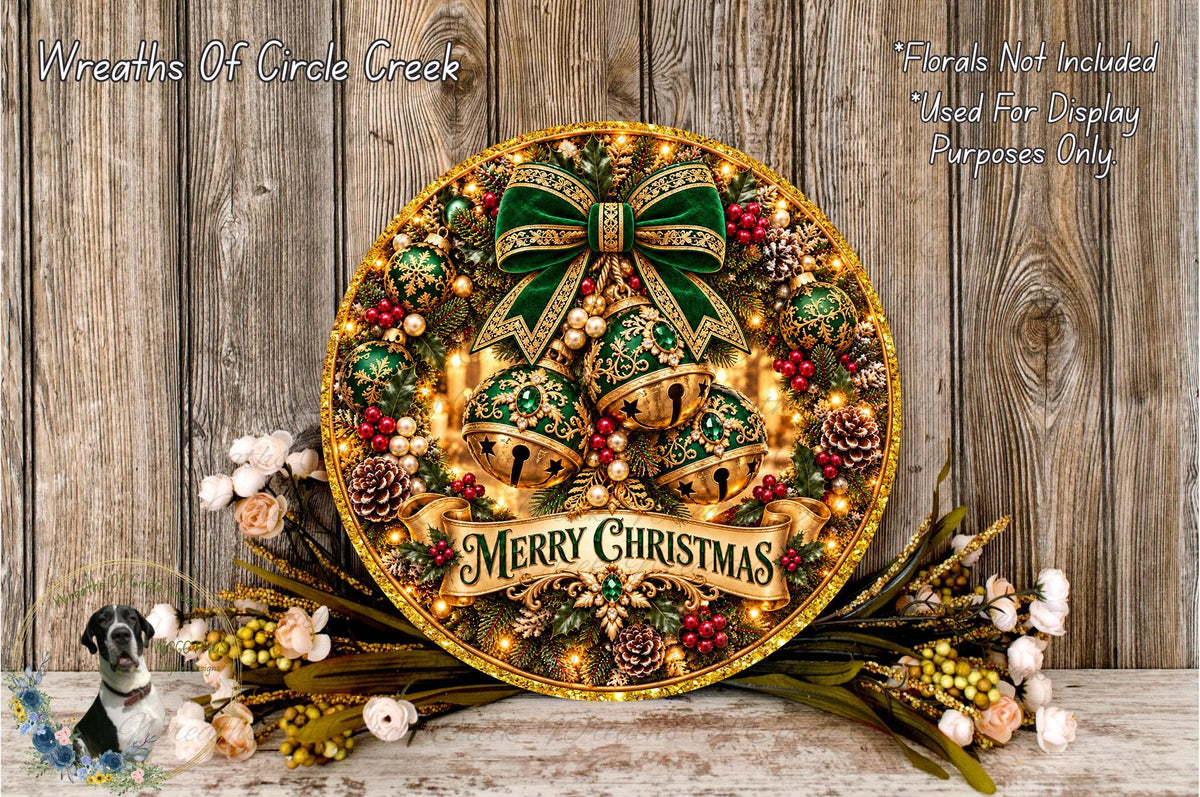 A festive Christmas wreath with a green bow, gold bells, and a "Merry Christmas" banner, surrounded by pine cones, berries, and flowers, placed on a wooden surface.