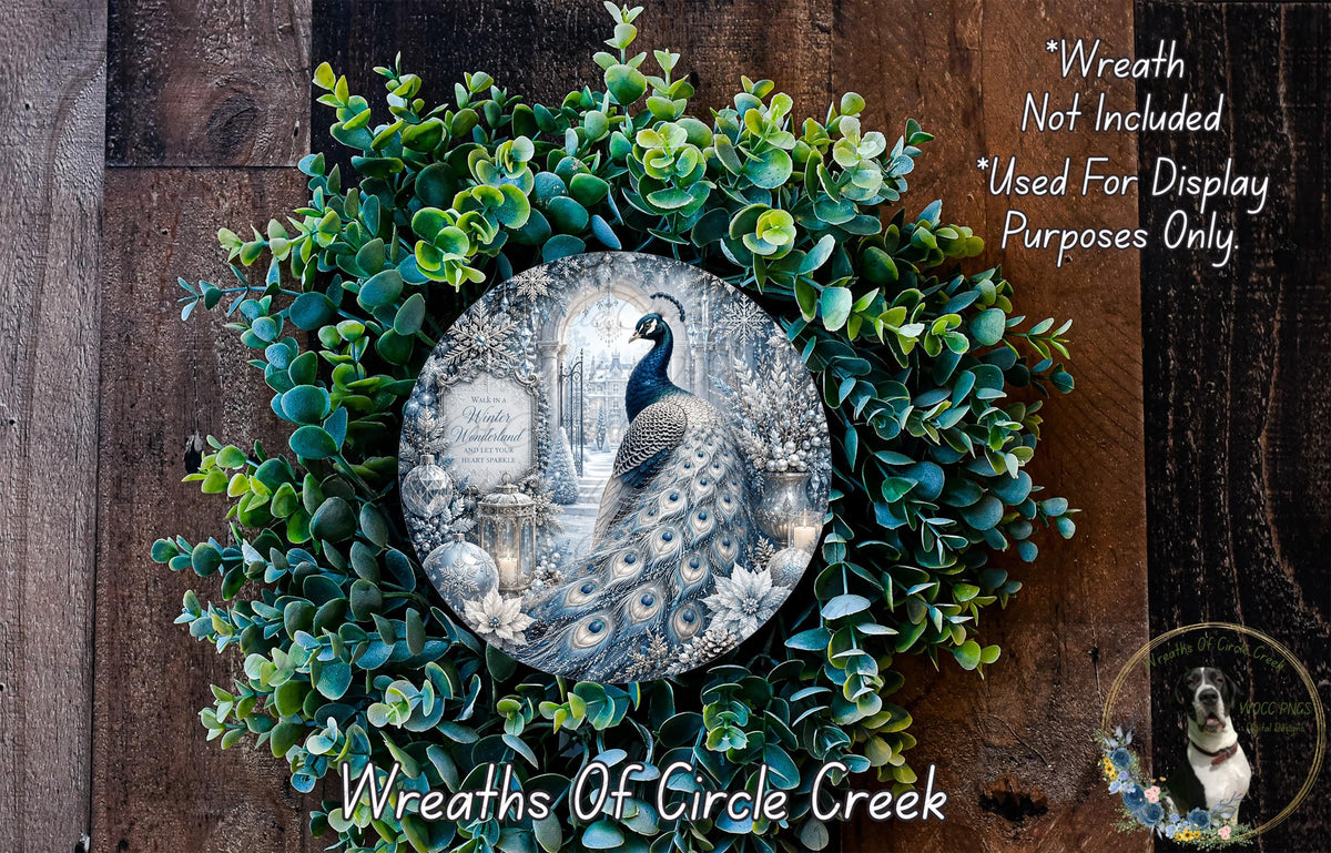 A decorative wreath made of green foliage and a decorative plate featuring a peacock. The wreath is displayed on a wooden surface, and the plate is mounted on the wreath.
