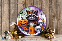 A Halloween-themed wreath featuring a raccoon wearing a hooded cloak, a carved jack-o-lantern, and two skull decorations, surrounded by colorful flowers and greenery.
