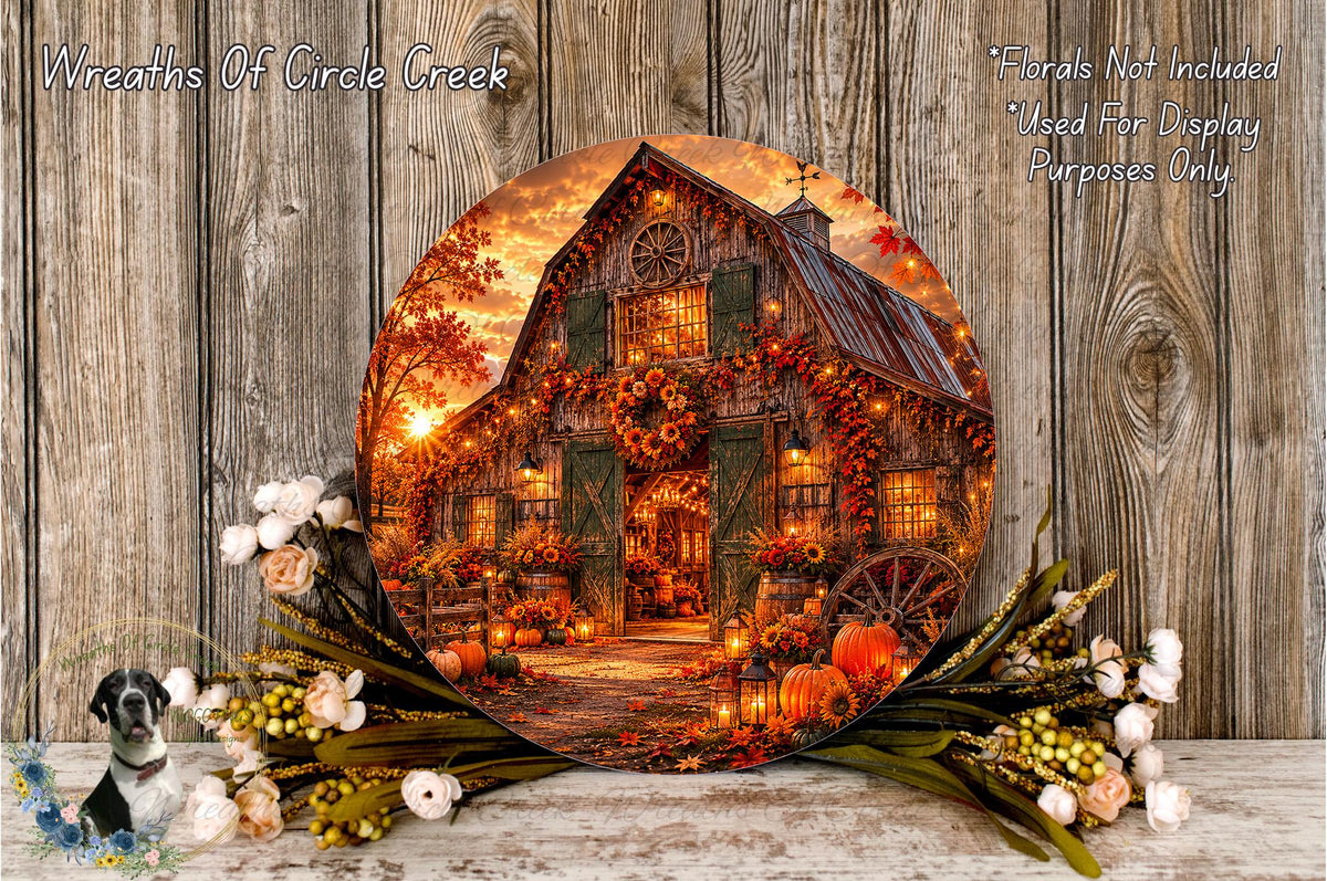 A round wooden plaque displaying a beautifully decorated autumn scene with a barn, pumpkins, and flowers, set against a wooden background.
