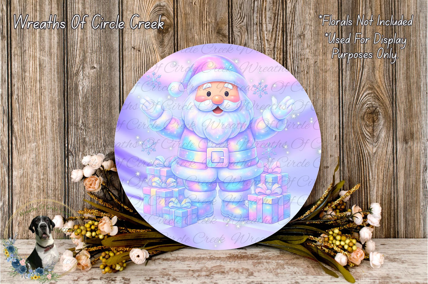A round, colorful wreath with a Santa Claus figure on it, surrounded by flowers and placed on a wooden surface.