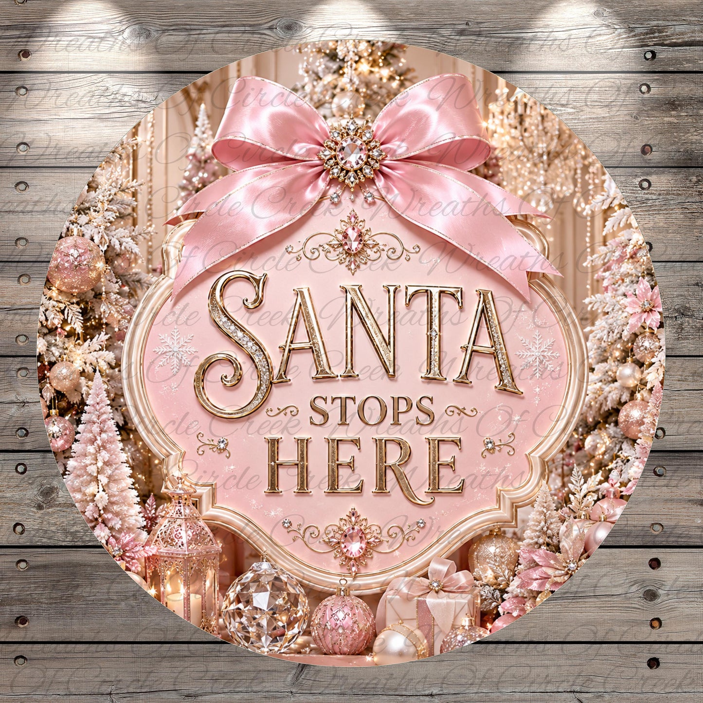 a festive Christmas scene with a pink ribbon and a sign that reads "Santa stops here". The background includes a snowy landscape with trees and ornaments, creating a winter wonderland atmosphere.