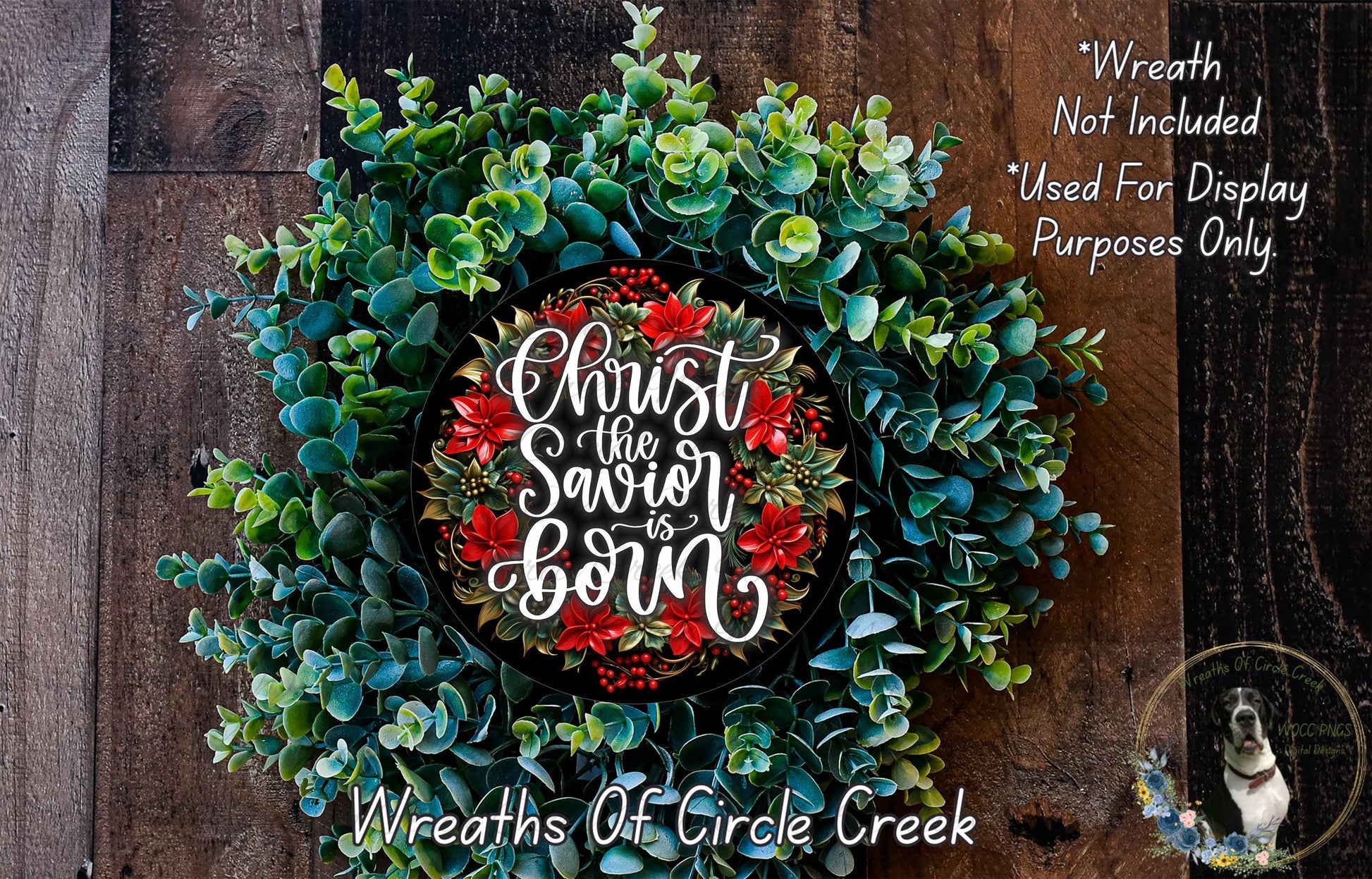 A wreath made of various greenery and red poinsettias, with a message that reads "Christ the Saviour is born" in the center.