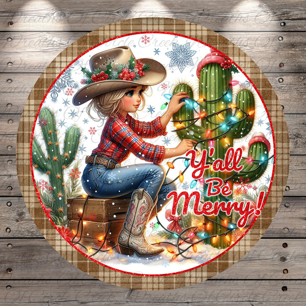 A cartoon illustration of a young girl sitting on a suitcase, surrounded by Christmas lights, cacti, and snowflakes, with the text "Y'all Be Merry!"