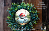 a wreath with a fishing rod and a red and white fishing lure, surrounded by greenery. The wreath is described as a "Wreath of Circle Creek" and is not included in a display for purposes other than decoration.
