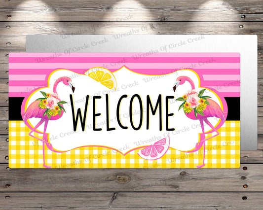 a welcome sign with flamingos and lemons