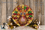 A decorative turkey wreath with colorful jewels and flowers, placed on a wooden surface.