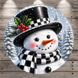 A cheerful snowman with a black and white top hat, scarf, and red berries, set against a snowy winter landscape with pine trees.