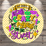 a vibrant and colorful text that reads "We don't hide crazy, we parade it on the street" in a playful and whimsical style.