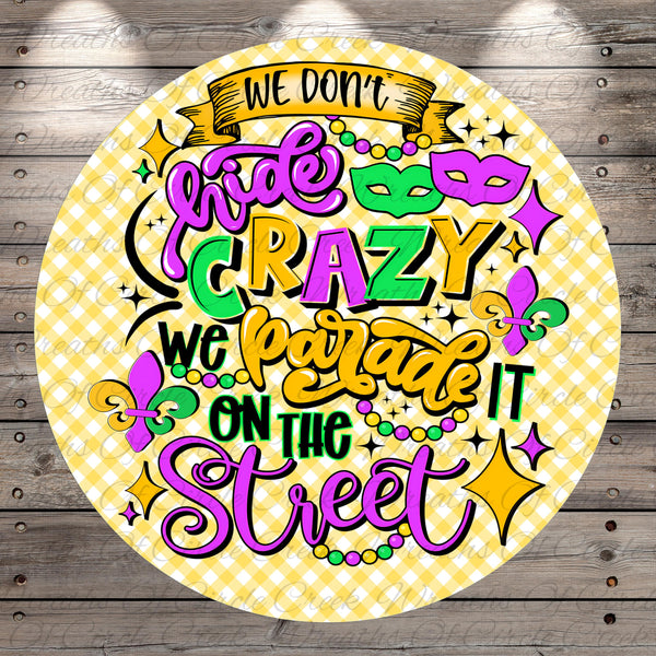 a vibrant and colorful text that reads "We don't hide crazy, we parade it on the street" in a playful and whimsical style.