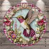 A decorative plate featuring a detailed illustration of a hummingbird surrounded by a floral wreath.