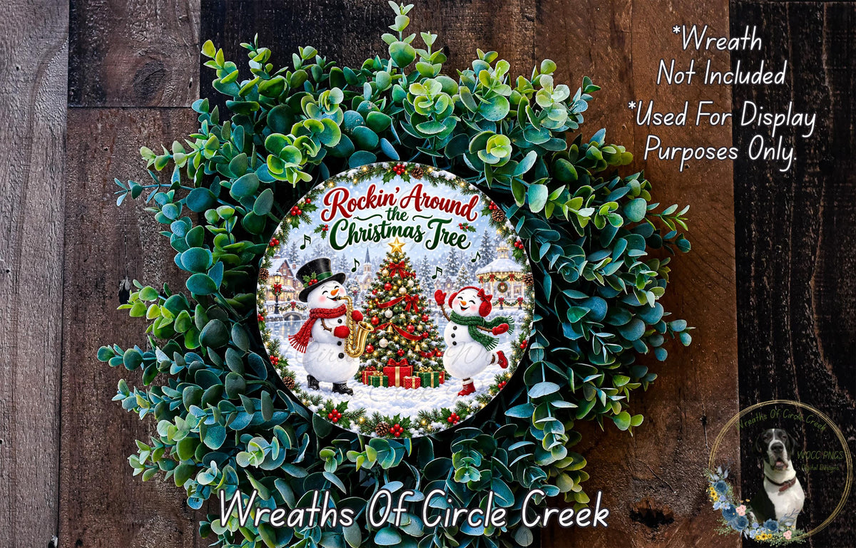 A wreath made of evergreen branches and a Christmas tree, featuring a snowman and other winter-themed elements.