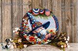 A decorative plate featuring a gnome wearing a wizard's hat and surrounded by patriotic elements such as American flags and flowers.
