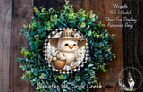 A wreath featuring a cartoon chicken holding a basket of flowers, surrounded by a lush green plant.