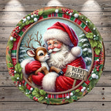 Santa Claus and his reindeer are depicted in a festive holiday scene, with Santa wearing a red suit and holding a reindeer. The background features a snowy landscape with pine trees and berries, and a wreath surrounds the image. A sign in the center of the image reads "MERRY & BRIGHT".