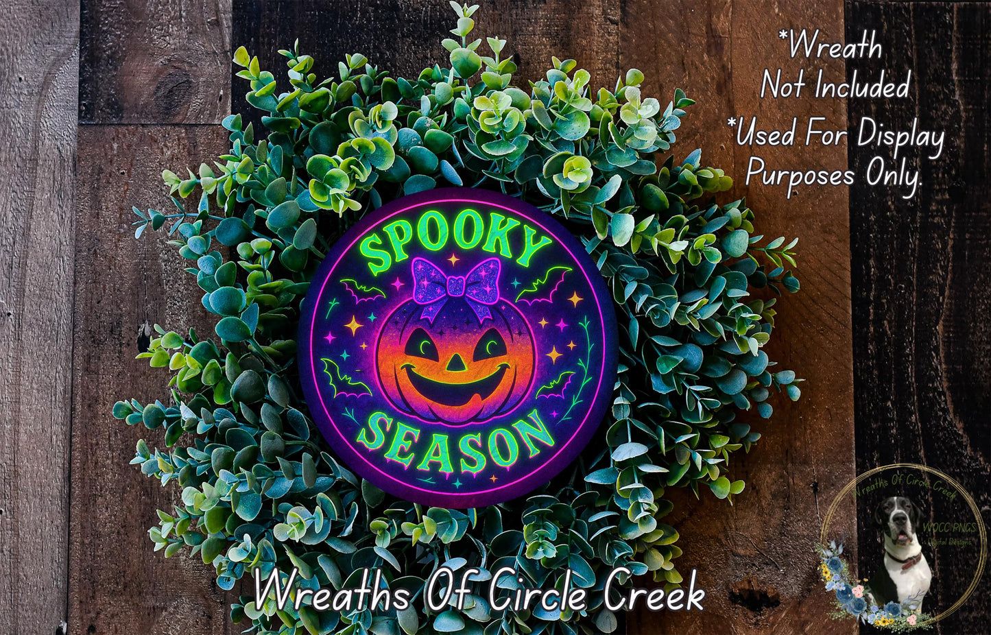 a wreath that says spooky season with a pumpkin on it