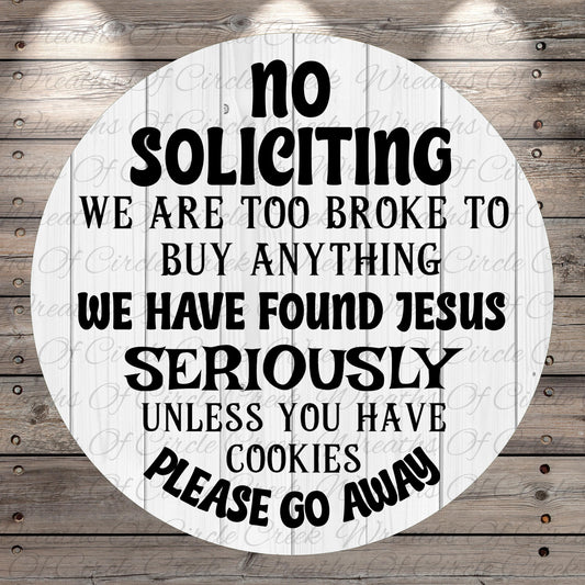 a circular sign with a humorous and somewhat offensive message. The sign reads: "No Solicitation, We are too broke to buy anything we have found Jesus seriously unless you have cookies please go away".