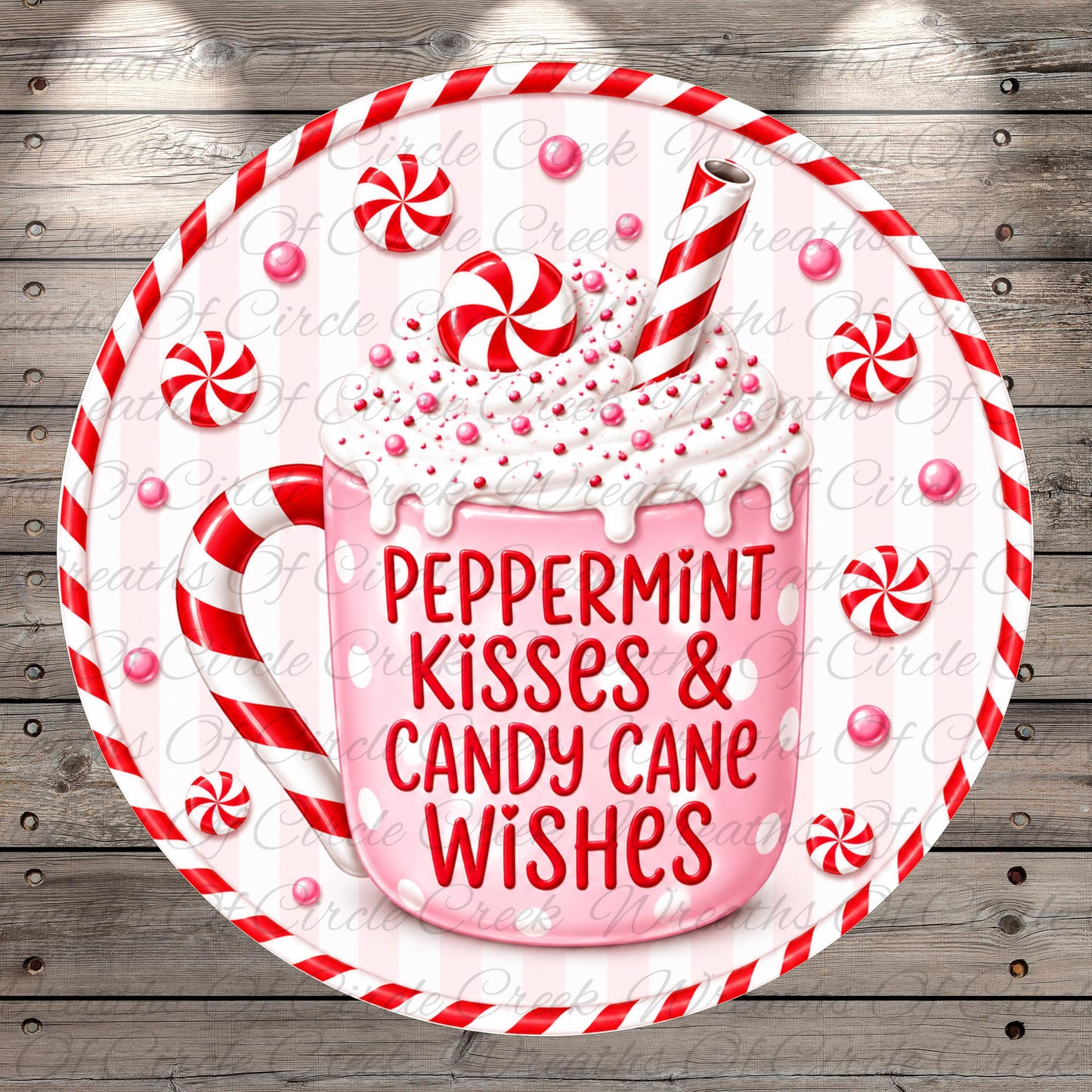 A pink mug filled with whipped cream and surrounded by red and white striped candy canes, with the text "Peppermint Kisses & Candy Cane Wishes" written on the mug.