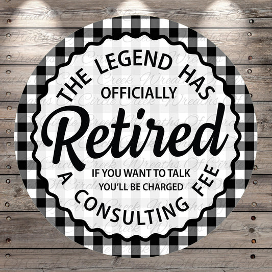 a humorous text that reads "The Legend Has Officially Retired A Consulting Fee" in a circular design with a checkered border.