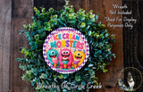 a wreath made of green plants and colorful cartoon monster characters, with the text "Ice Cream Monsters" displayed on the wreath.