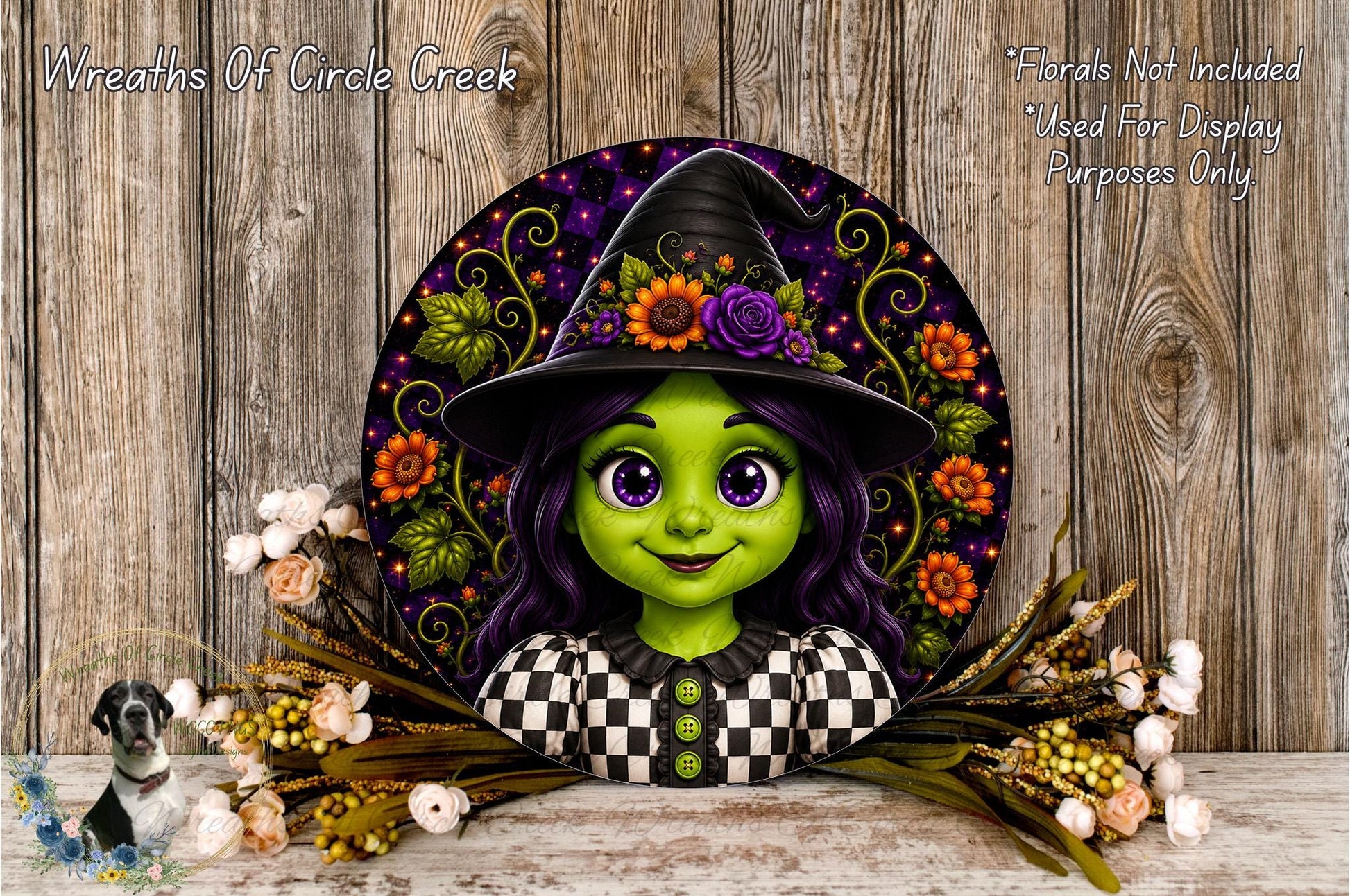 A decorative wreath featuring a cartoon image of a young girl with purple hair and a witch's hat, surrounded by flowers and greenery.