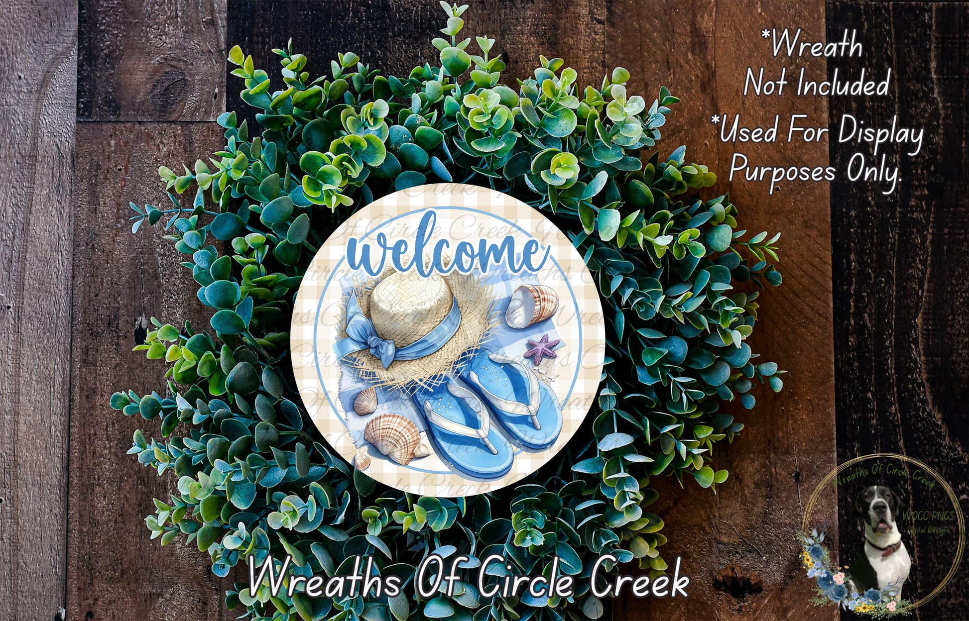a wreath with a welcome sign, surrounded by a lush green plant. The wreath is placed on a wooden surface, and there is a small dog in the bottom right corner of the image.
