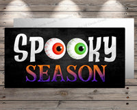 a sign that says spooky season on it