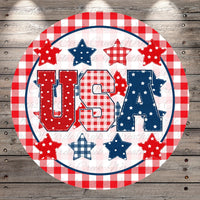 A circular design featuring the word "USA" surrounded by stars and plaid patterns in red, white, and blue colors.