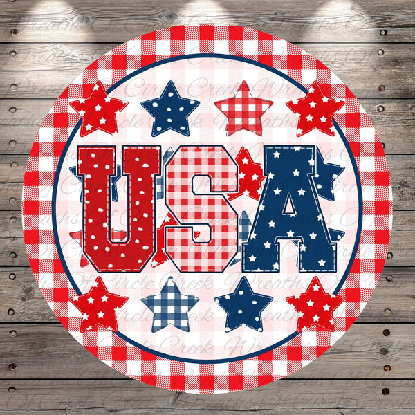 A circular design featuring the word "USA" surrounded by stars and plaid patterns in red, white, and blue colors.