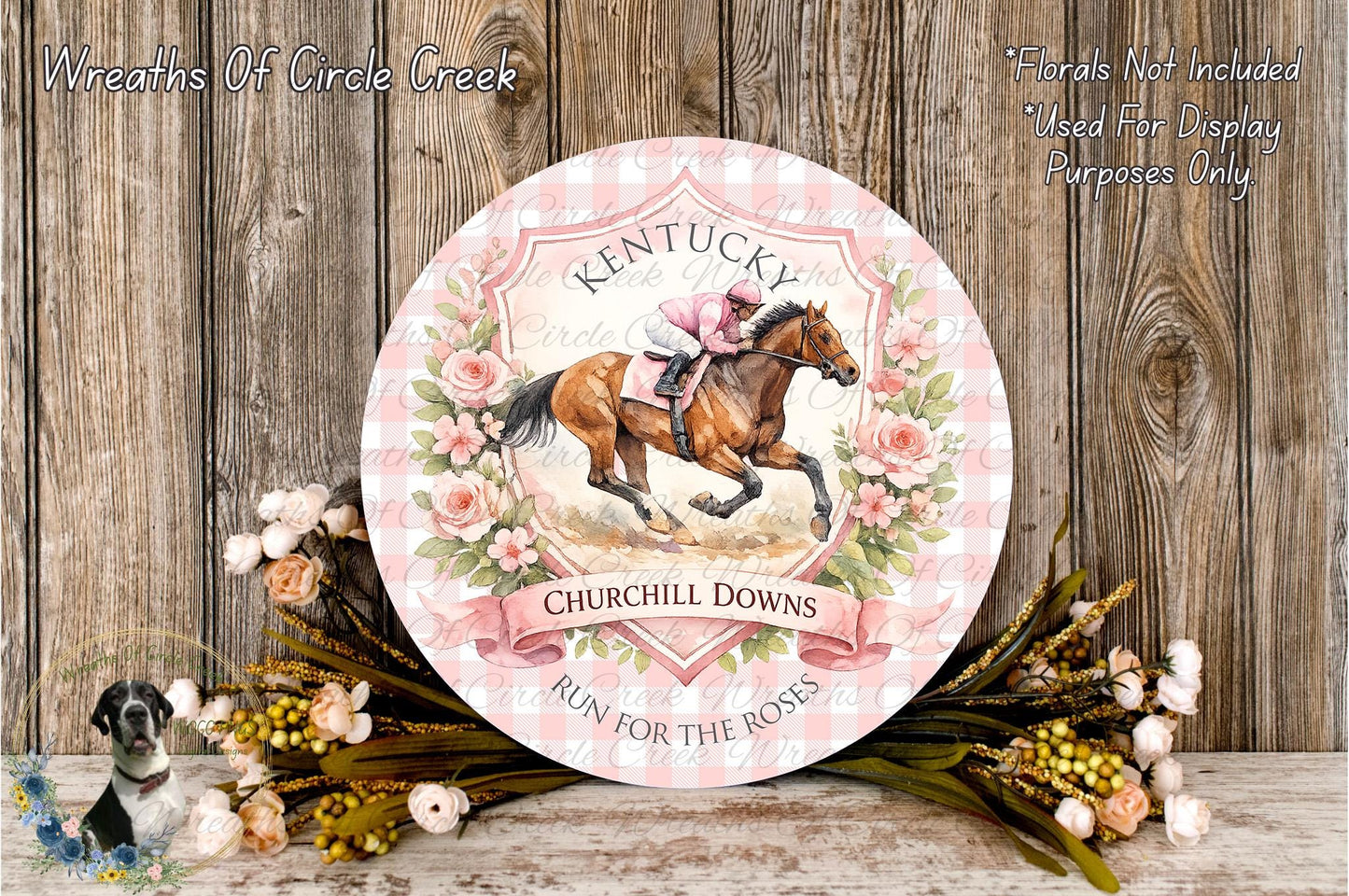 A decorative plate featuring a horse and rider, surrounded by flowers and a banner that reads "Kentucky Churchill Downs", placed on a wooden surface.