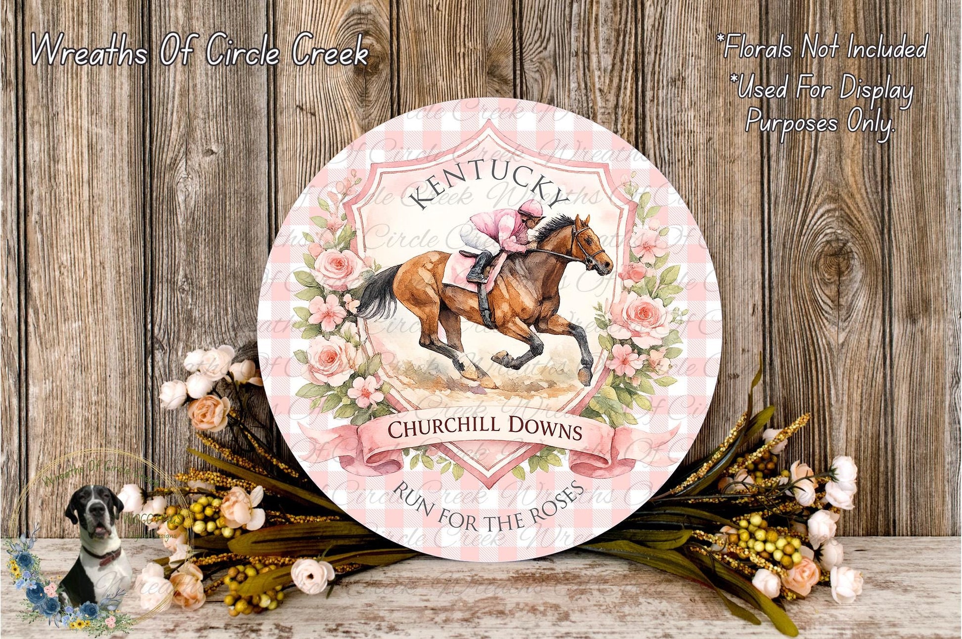 A decorative plate featuring a horse and rider, surrounded by flowers and a banner that reads "Kentucky Churchill Downs", placed on a wooden surface.