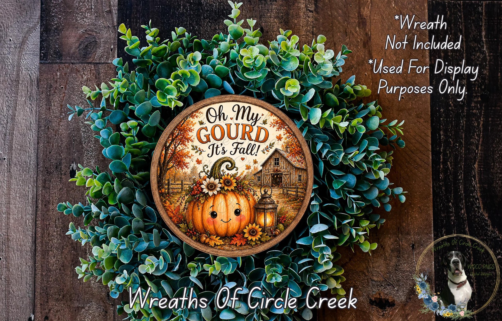 a wreath with a pumpkin and a barn, surrounded by greenery, and a sign that reads "Oh My Gourd It's Fall".