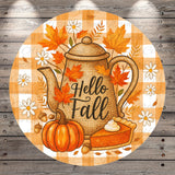 A round, wooden-paneled image featuring a teapot surrounded by autumn leaves, flowers, and a pumpkin with a pie on it. The text "Hello Fall" is displayed on the teapot.