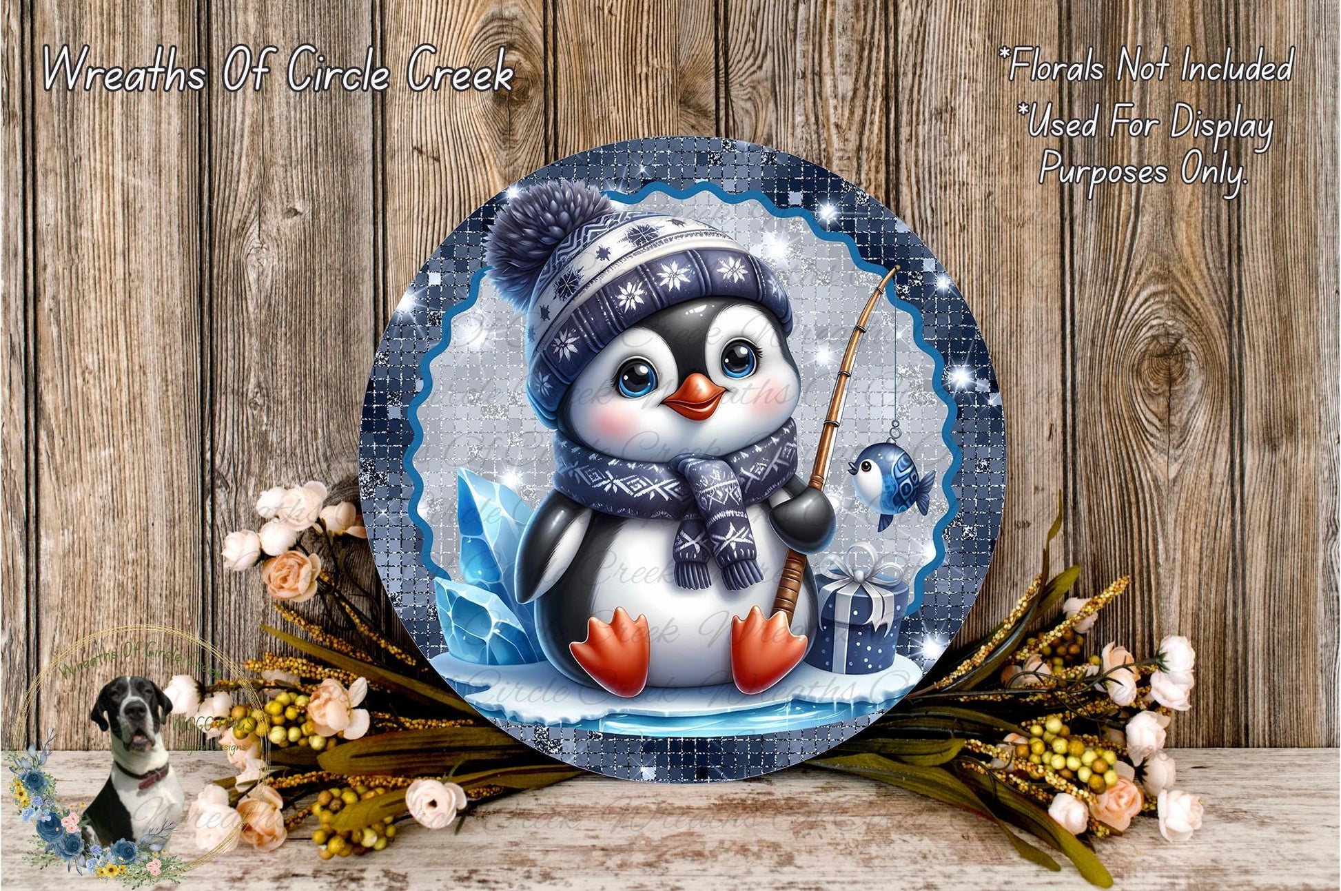 A decorative plate featuring a cute penguin wearing a winter hat and scarf, holding a fishing rod and surrounded by flowers and greenery.