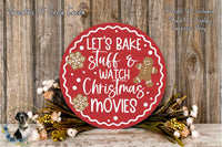 A red circular sign with white text that says &quot;Let&#39;s Bake Stuff & Watch Christmas Movies&quot; is surrounded by a wreath of flowers and a gingerbread man decoration.