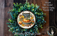 a wreath made of various autumn-themed elements, including a pumpkin, sunflowers, and cinnamon sticks. The wreath is displayed on a wooden surface, and there is a sign that reads "Autumn Spice" in the center.