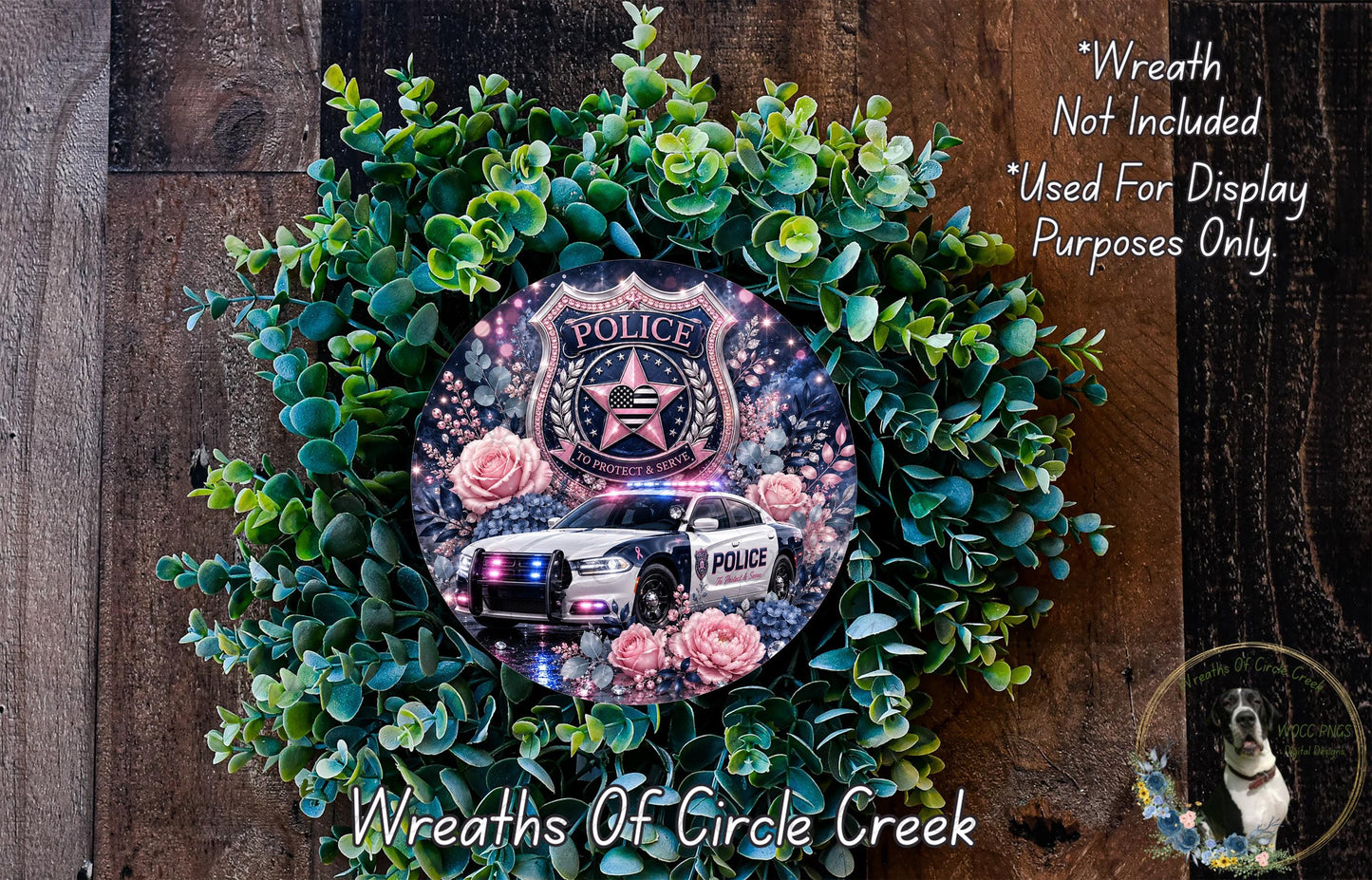 A wreath made of green leaves and flowers, with a police car image displayed on it.